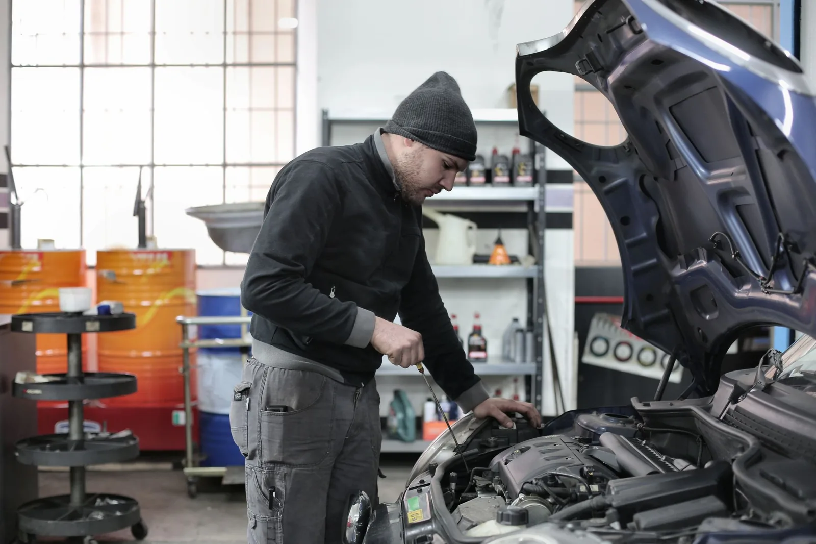 Mechanic inspecting an engine in a repair shop