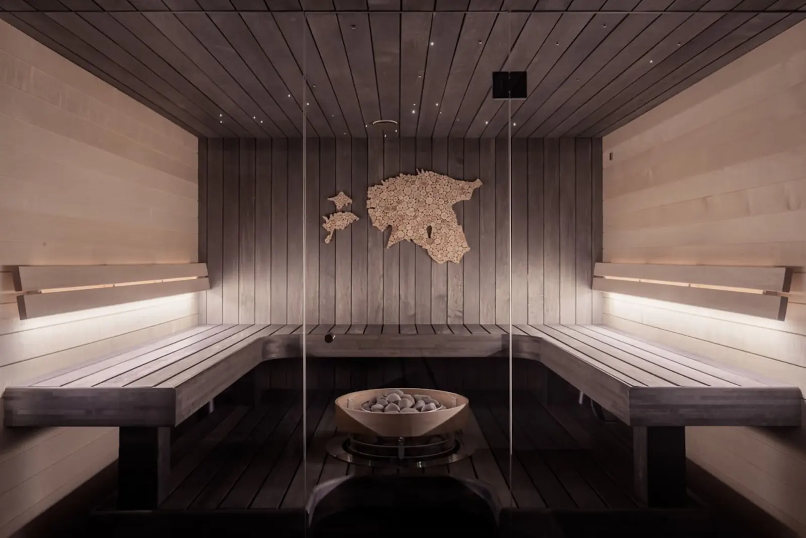 Calm, dimly lit massage clinic interior with a wooden wall
