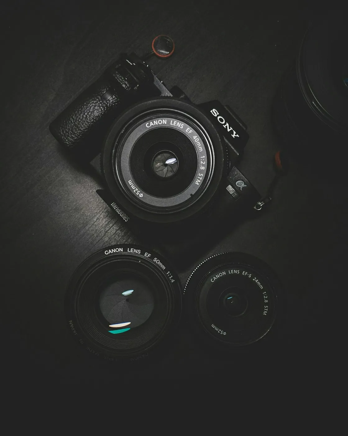 Camera and lens on a dark background