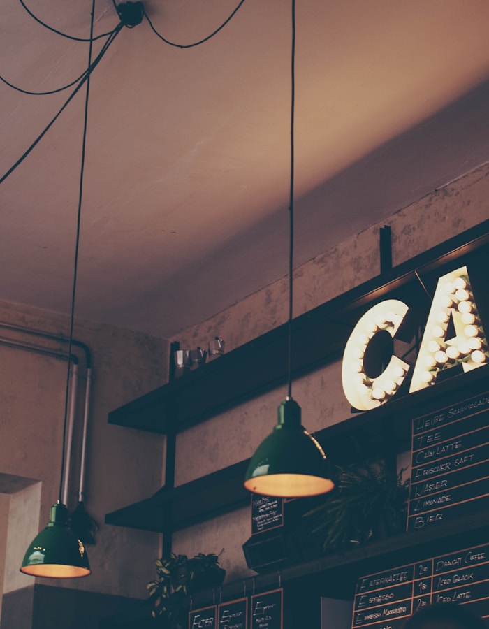 Coffee shop interior with wooden tables and warm lighting